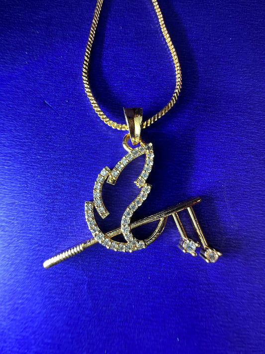 A gold pendant necklace featuring a stylized flame and crossed tools, paved with small clear stones, hanging from a gold chain against a vibrant blue background.